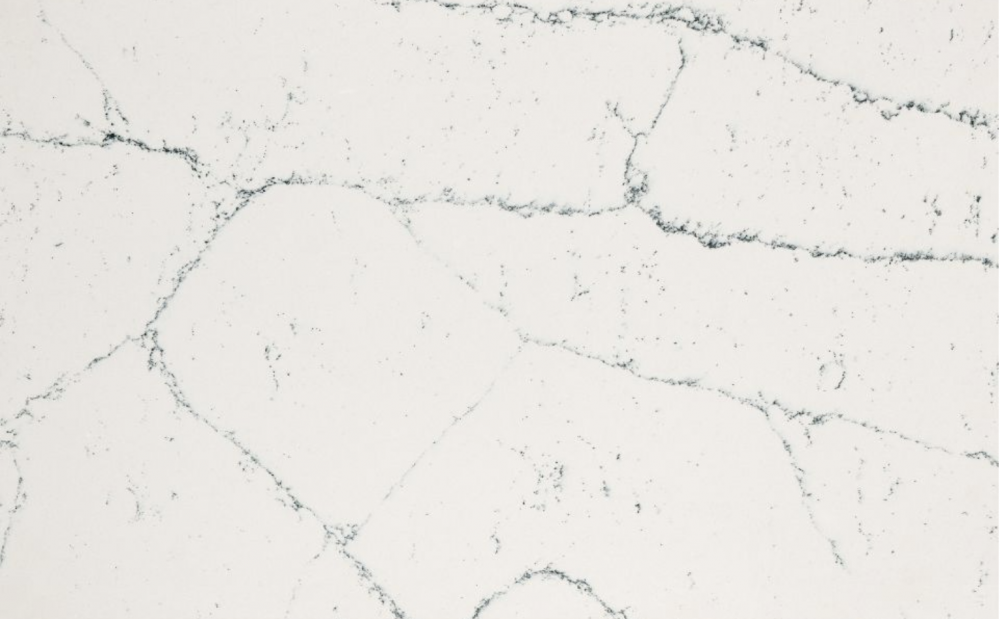 Archdale quartz slab featuring a crisp white background and dark grey spiderweb veining in Darien Archdale quartz slab with a crisp white background and dark grey spiderweb veining forming geometric shapes in Darien
