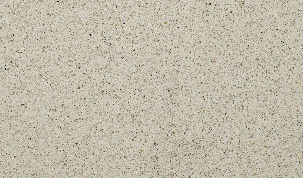Bayshore Sand quartz slab featuring a warm beige base with speckled aggregate pattern for countertops in Northbrook Bayshore Sand quartz slab with warm beige background and speckled aggregate pattern, ideal for countertops in Northbrook homes