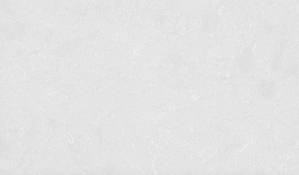 Calico White quartz slab featuring a smooth white surface with subtle grey speckles, ideal for countertops and neutral design schemes in Downers Grove Calico White quartz slab with soft white background and gentle grey speckles, ideal for countertops in Downers Grove homes