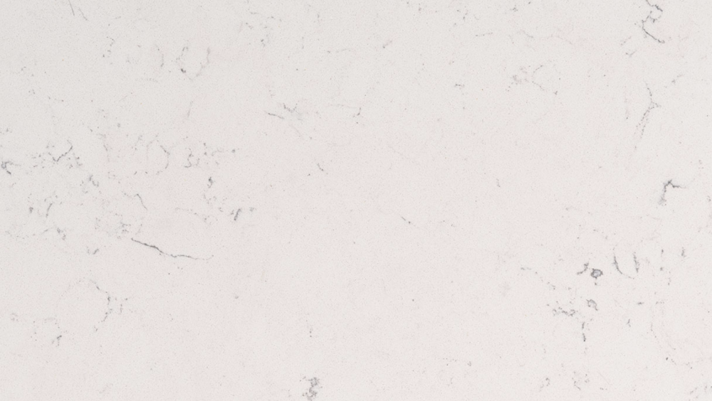 Carrara Marmi quartz slab featuring a gentle white base with subtle grey veining, ideal for refined countertops and backsplashes in Oak Park Carrara Marmi quartz slab with creamy white background and soft grey veins, ideal for countertops in Oak Park homes
