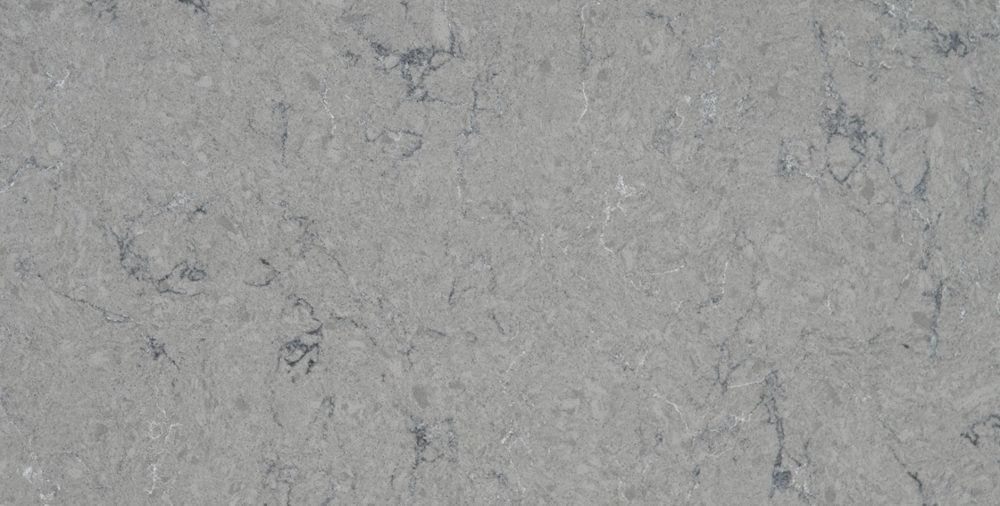 Fantasy Gray quartz slab featuring swirling light and dark gray veining for countertops and accent walls in Highland Park Fantasy Gray quartz slab with swirling light and dark gray veining, ideal for countertops in Highland Park homes