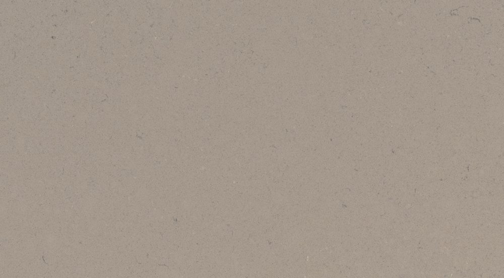 Fossil Taupe quartz slab with warm taupe tones and fossil-like speckles for countertops in Deerfield Fossil Taupe quartz slab featuring a warm taupe background with subtle fossil-like speckles, ideal for countertops in Deerfield homes