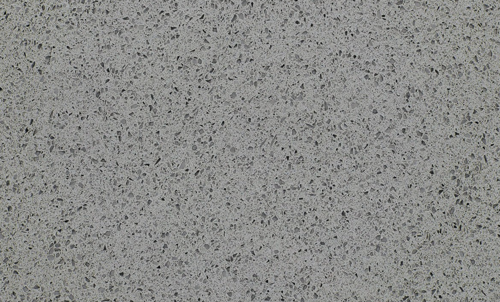 Iced Gray quartz slab featuring a medium gray background with speckled aggregate pattern, perfect for countertops and flooring in Arlington Heights Iced Gray quartz slab with a medium gray base and speckled pattern, ideal for countertops in Arlington Heights homes