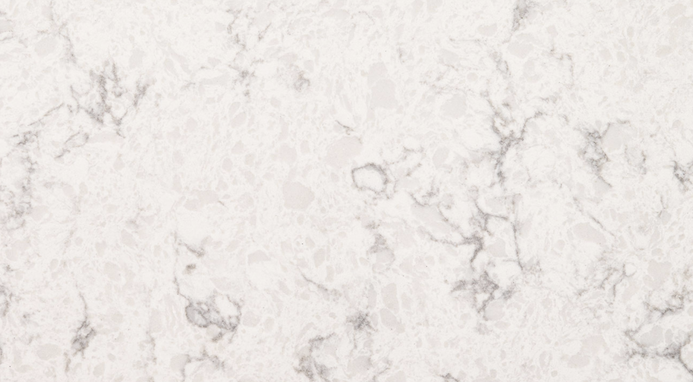 Refined Mara Blanca quartz slab featuring a creamy white base with gentle grey marbling, ideal for elegant countertops and backsplashes. Mara Blanca quartz slab with creamy white background and soft grey marbling