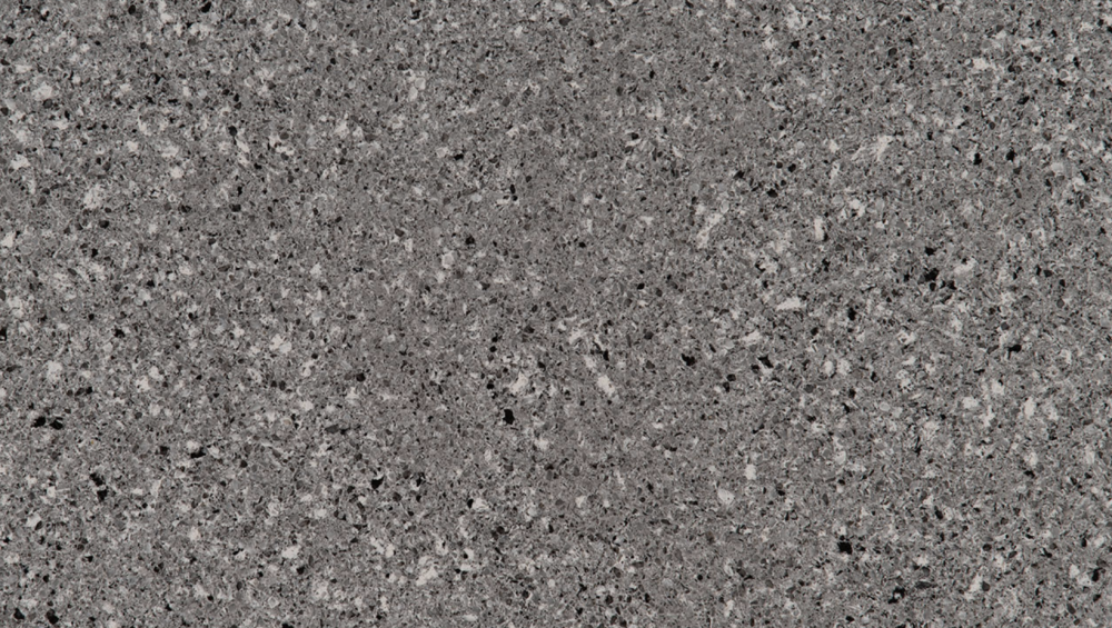 Pearl Gray quartz slab featuring a gentle gray base with subtle speckles, perfect for countertops and backsplashes in Lisle Pearl Gray quartz slab with a soft gray background and fine speckles, ideal for countertops in Lisle homes