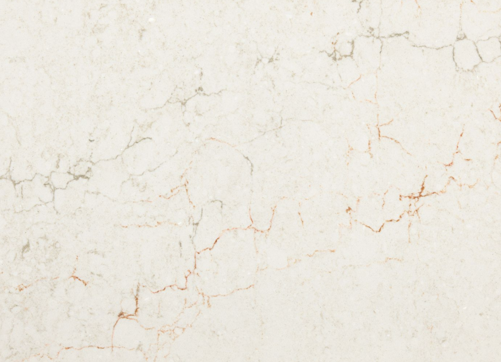 Ridgegate quartz slab featuring a warm cream background and subtle rusty orange veining in Downers Grove Ridgegate quartz slab with a warm cream background and subtle rusty orange veining in Downers Grove