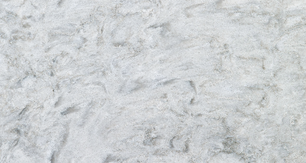 Rolling Fog quartz slab featuring a light grey base with wispy white veining for countertops in Wilmette Rolling Fog quartz slab with light grey base and subtle wispy white veining, ideal for countertops in Wilmette homes