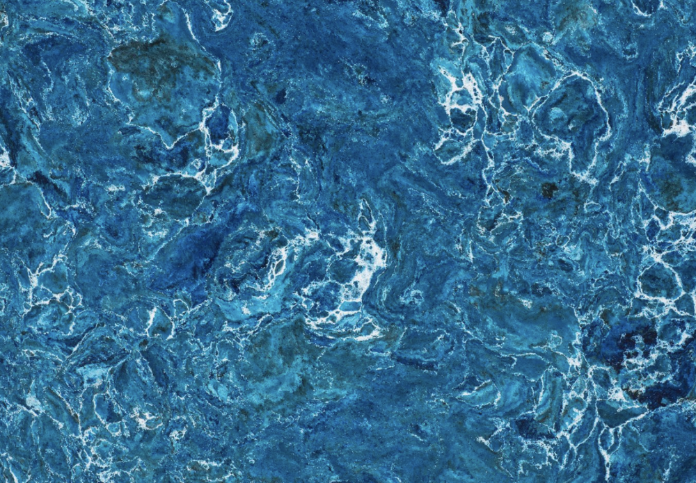 Skye quartz slab features rich deep blue hues with swirling white marbling in Highland Park Skye quartz slab with rich deep blue hues and swirling white marbling in Highland Park