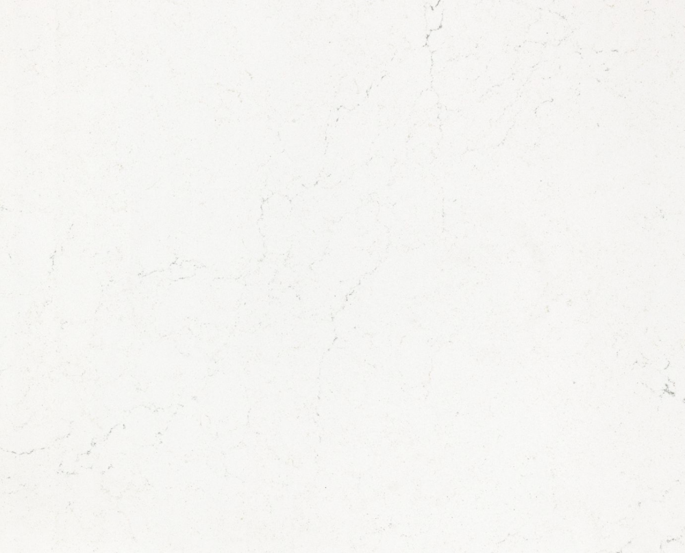 Smithfield quartz slab featuring a clean white base with subtle whispery veining in Winnetka Smithfield quartz slab with a clean white base and subtle whispery veining in Winnetka