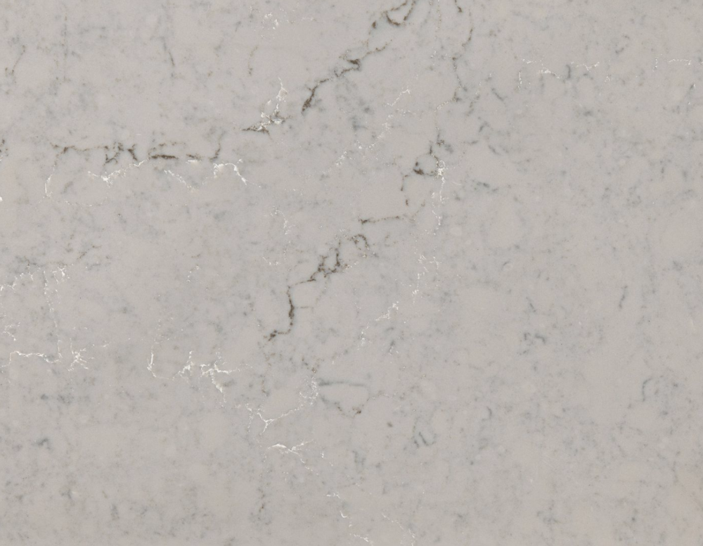 St Giles quartz slab showcasing a warm taupe base with delicate white and grey veining in Deerfield St Giles quartz slab with a warm taupe base and delicate white and grey veining in Deerfield