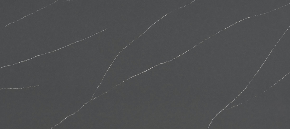 Soapstone Metropolis quartz slab featuring a dark charcoal background with subtle white veining for countertops in Oak Brook Soapstone Metropolis quartz slab with dark charcoal background and subtle white veining, ideal for countertops in Oak Brook homes