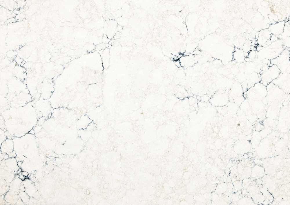 Travella quartz slab from Cambria featuring a soft white base with dramatic dark gray veining in River Forest Travella quartz slab with a soft white base and dramatic dark gray veining in River Forest