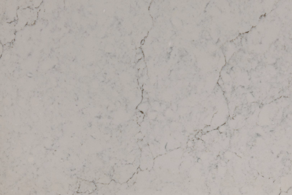 Cambria Windrush quartz features a soft ivory base with subtle grey veining. Windrush quartz surface with soft ivory background and delicate grey veining across the slab